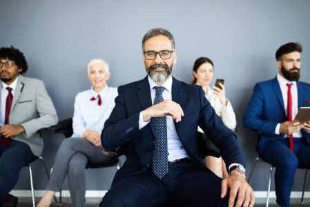 Group of business people with leader at front Group of business people with leader at front
